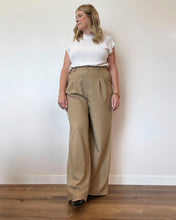 Load image into Gallery viewer, work outfit with a white sleeveless sweater and khaki colored pleated slacks