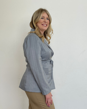 Load image into Gallery viewer, Woman wearing a light blue pinstripe blazer against a white background