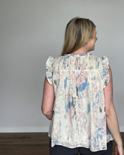 Load image into Gallery viewer, Back of woman in a watercolor-esque print tank with an ivory background featuring a keyhole closure.