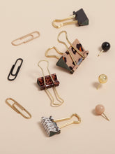 Load image into Gallery viewer, Animal print binder clips. Black, gold and tan sphere push pins. Black and gold paper clips.
