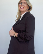 Load image into Gallery viewer, Woman wearing a dark brown blazer over a white shirt against a plain background

