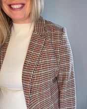 Load image into Gallery viewer, close up of houndstooth print on blazer. A combination of burgundy, cream, tan and dark brown
