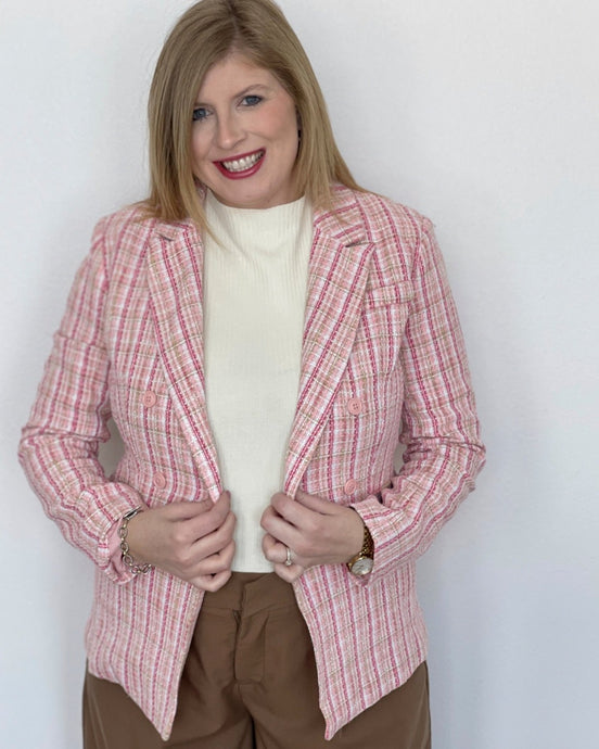 woman in pink tweed blazer