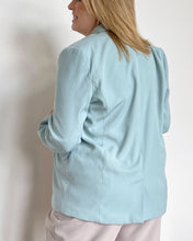 Load image into Gallery viewer, Back of woman wearing a light blue, long sleeve solid woven blazer
