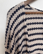 Load image into Gallery viewer, Close up of knit cardigan, navy diamond pattern with ivory background
