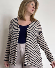 Load image into Gallery viewer, woman wearing a navy blue and ivory knit cardigan, wearing a navy tank top and light khaki pants
