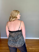 Load image into Gallery viewer, back of woman in olive green, white and black leopard print camisole top with black eyelash lace detail around v-neck
