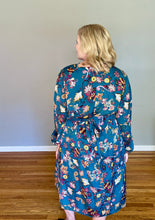 Load image into Gallery viewer, back of blonde woman wearing teal long sleeve dress with paisley pattern in burgundy, mustard and white
