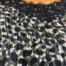 Load image into Gallery viewer, close up of olive green, white and black leopard print camisole top with black eyelash lace detail around v-neck
