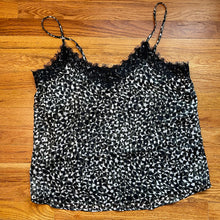 Load image into Gallery viewer, flay lay of olive green, white and black leopard print camisole top with black eyelash lace detail around v-neck
